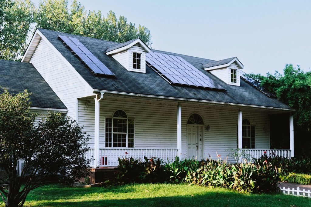 A small white house with a black roof